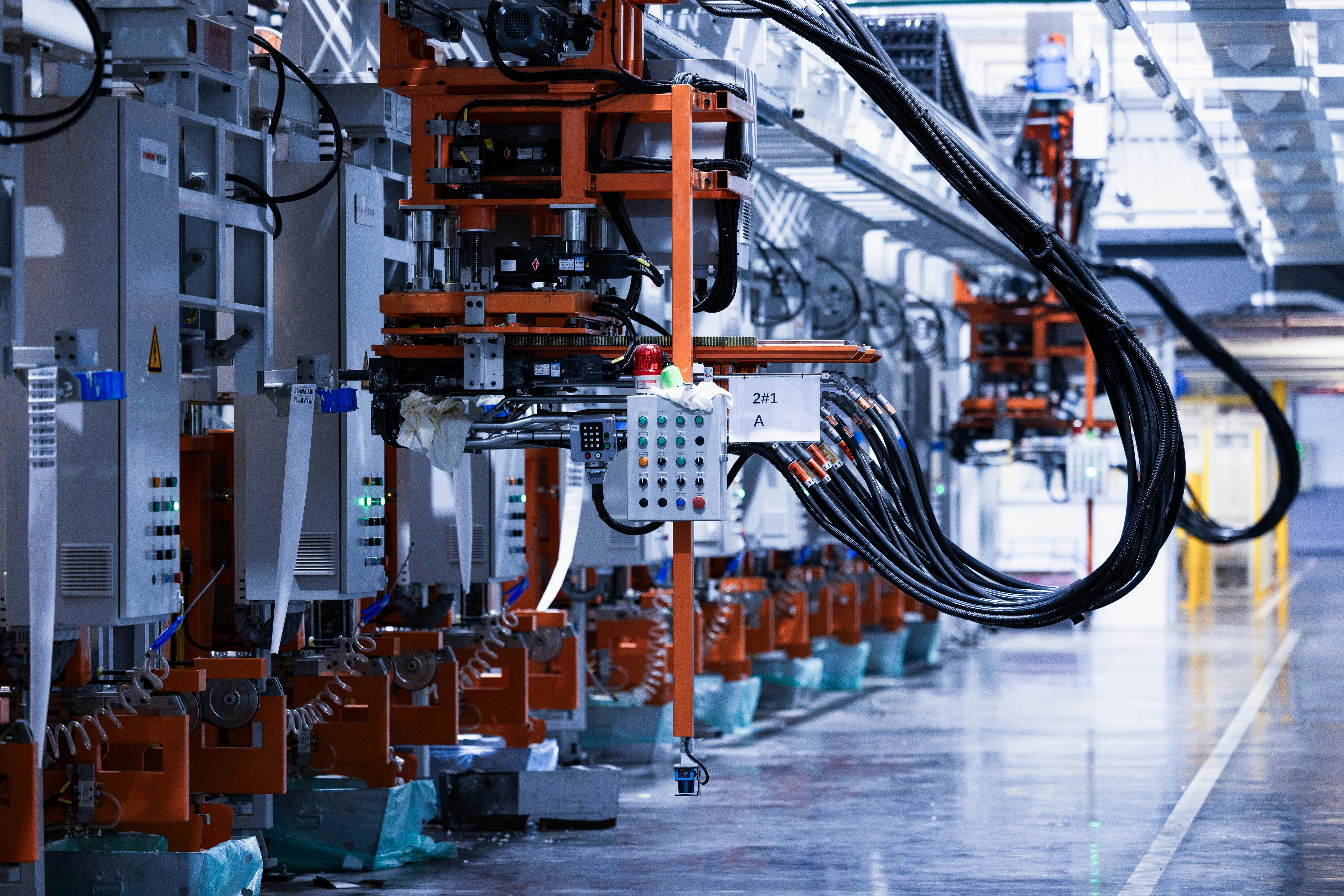 A line of electrical production equipment in a factory