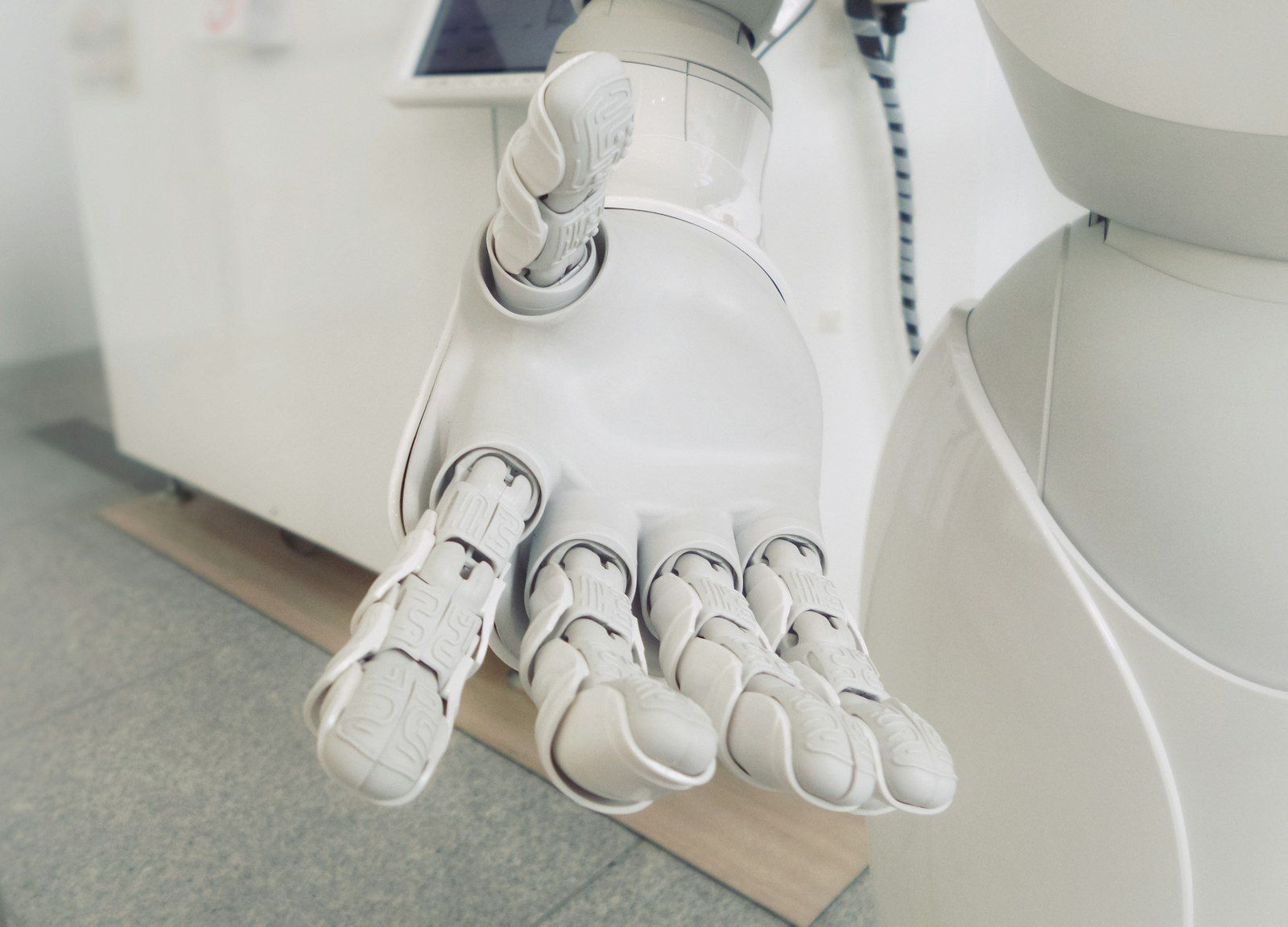White robotic hand representing AI chatbots
