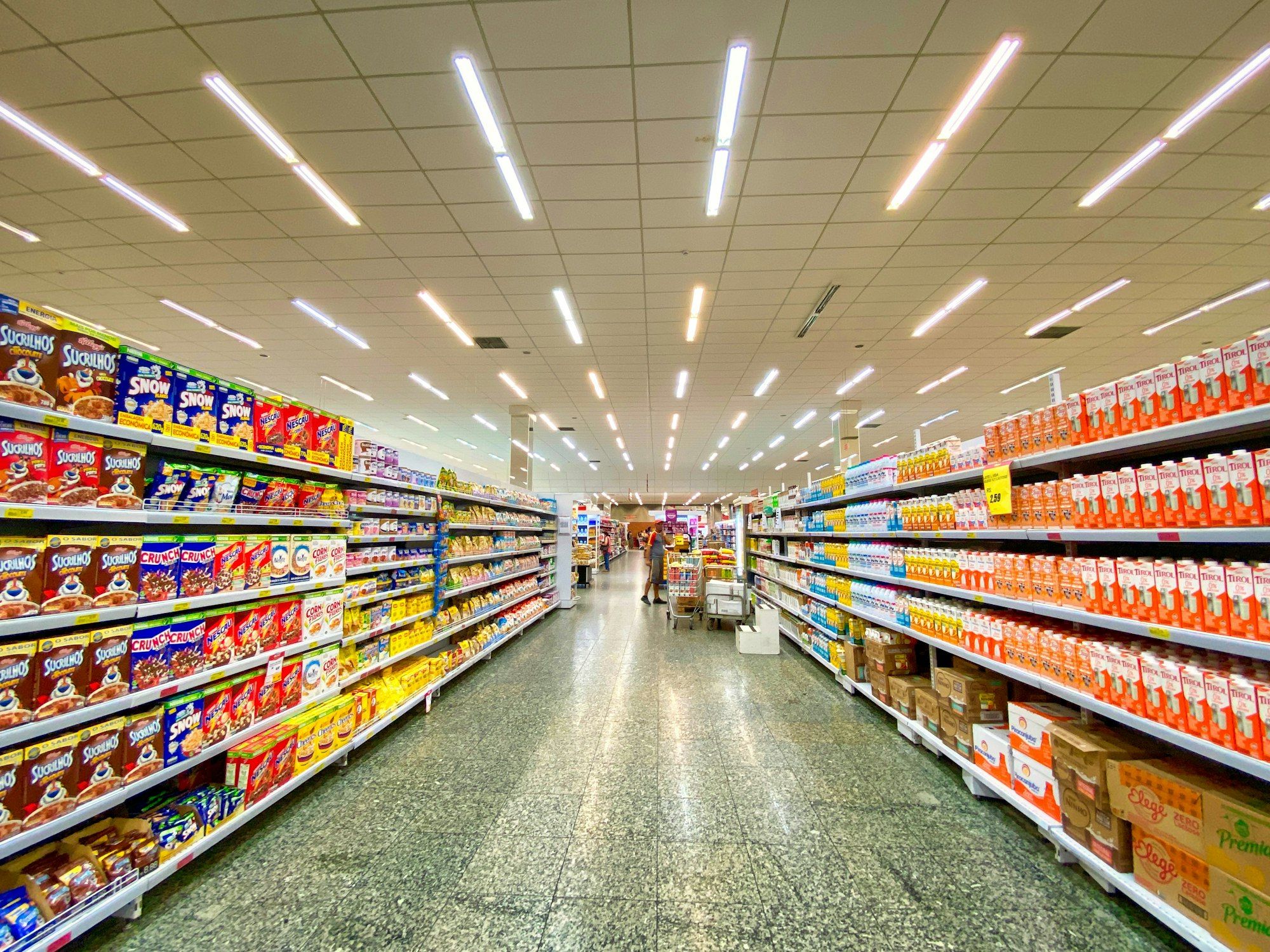 Fully stocked retail store aisle representing optimized inventory management