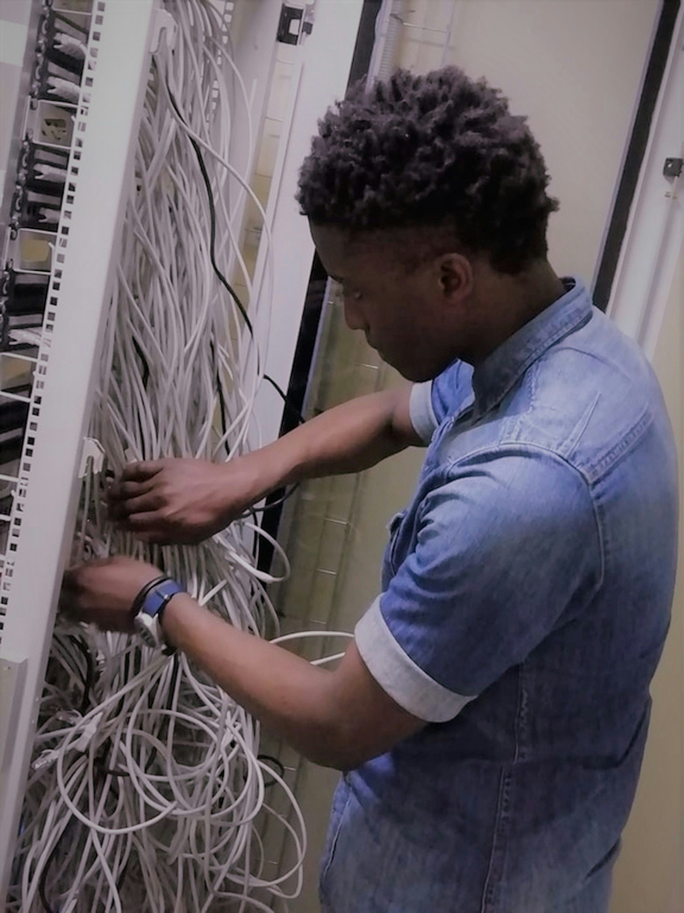 Technician configuring server infrastructure during a cloud migration